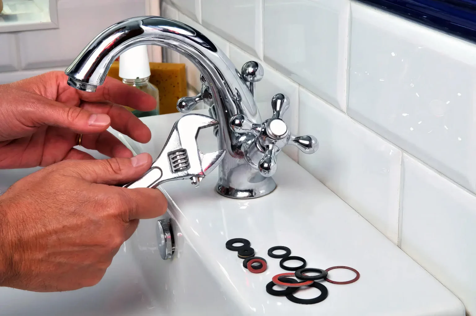 Plumber maintaining a bathroom faucet in Ladera Ranch