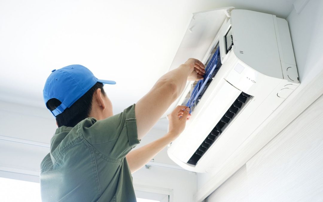 HVAC technician servicing a ductless mini split in Ladera Ranch