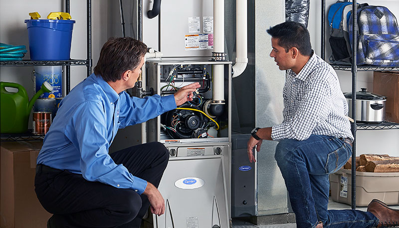 Technician evaluating a furnace for repair or replacement in Ladera Ranch