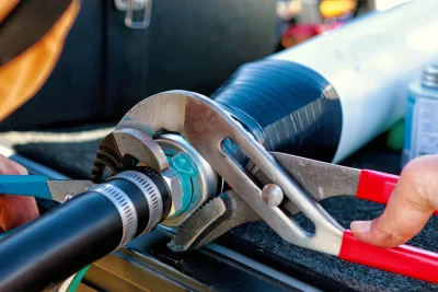 Technician repairing an industrial pipe connection in Ladera Ranch
