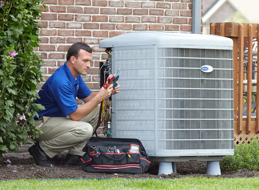 HVAC technician inspecting an outdoor AC unit in Ladera Ranch